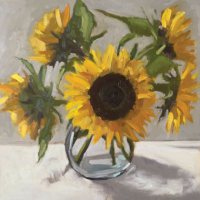 Sunflowers in a glass vase by Kirsten Elswood