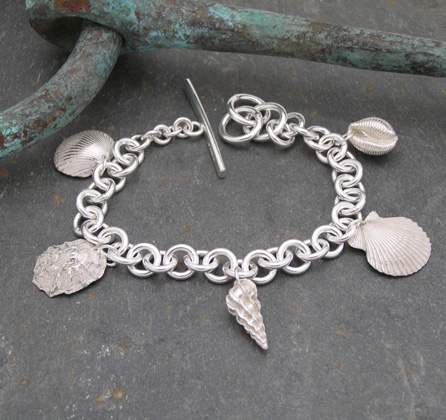 Five shell wrist chain<br>Wrist chains from £420 by Fay Page